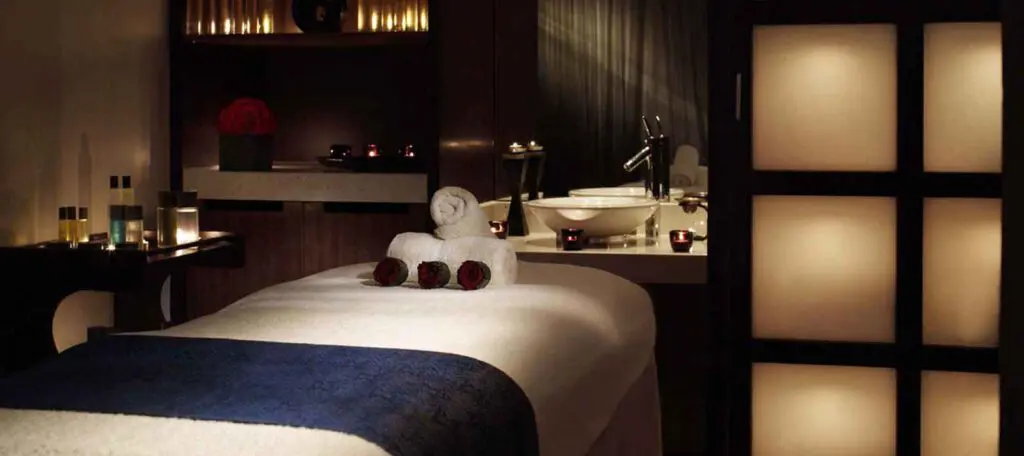 luxury spa room with massage table